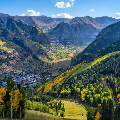 Sweeping Colorado mountain valley with aspen trees in fall color