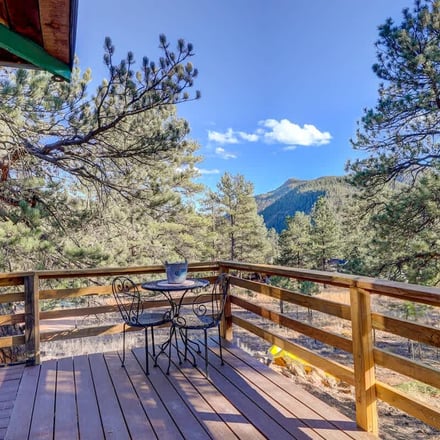 Deck with mountain views through the pines at the Pine cabin