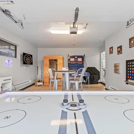 Game room with air hockey table, sauna, and basketball hoop at the Arvada property