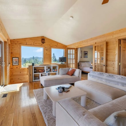 Pine Ace game room with pool table and mountain views through the windows